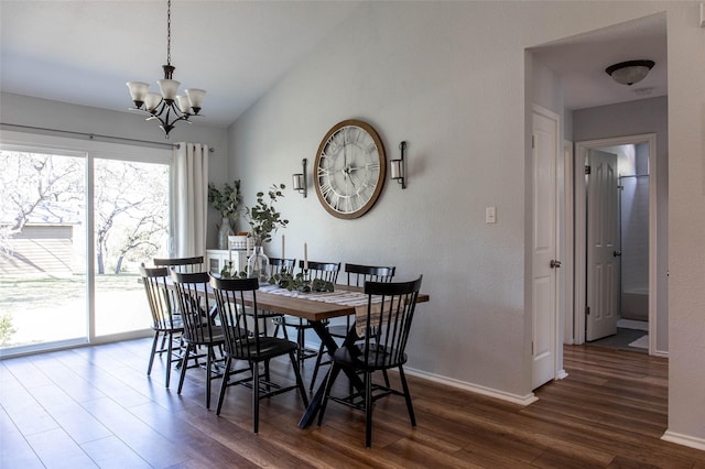 300 Coventry Rd, Spicewood, TX 78669 - dining space featuring wood finished floors, a chandelier, baseboards, and vaulted ceiling