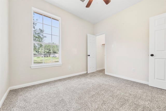 22618 Trailwood Ln, Tomball, TX 77375 - unfurnished bedroom with multiple windows, carpet floors, and baseboards
