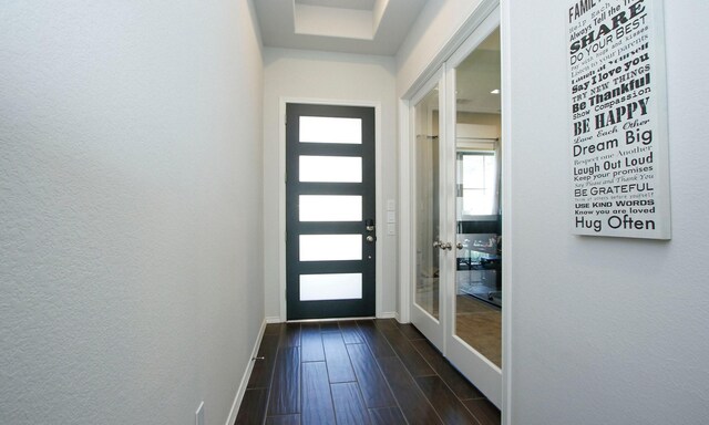 24618 Songlark Bend Dr, Tomball, TX 77375 - entryway featuring baseboards, dark wood-style flooring, french doors, and a textured wall