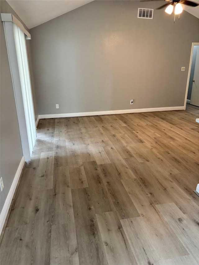 8818 Arbor Wood Dr, Houston, TX 77040 - spare room featuring ceiling fan, lofted ceiling, wood finished floors, and baseboards