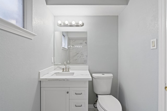 8818 Arbor Wood Dr, Houston, TX 77040 - full bath with toilet, vanity, a shower, and a textured wall