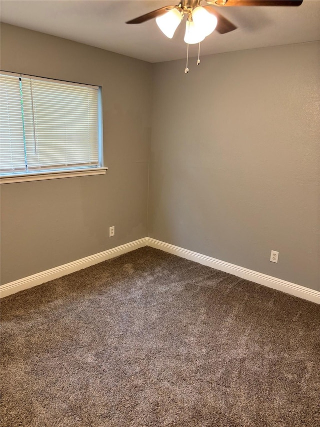 8818 Arbor Wood Dr, Houston, TX 77040 - empty room featuring a ceiling fan, dark carpet, and baseboards