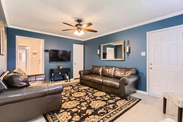 2401 Raspberry Ln, Pasadena, TX 77502 - living area featuring ceiling fan, a textured ceiling, ornamental molding, and baseboards
