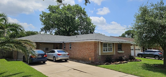 2401 Raspberry Ln, Pasadena, TX 77502 - view of front of property featuring concrete driveway, brick siding, a front yard, and an attached garage
