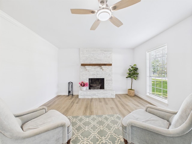 19503 Atascocita Shores Dr, Humble, TX 77346 - living room with wood finished floors, ceiling fan, and a stone fireplace
