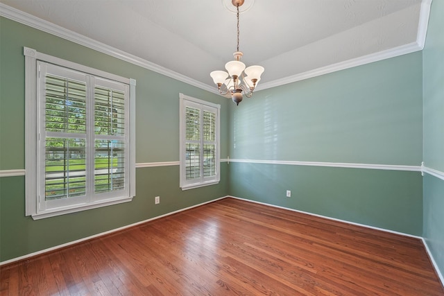 7931 Clarion Way, Houston, TX 77040 - unfurnished room with a chandelier, wood-type flooring, crown molding, and baseboards