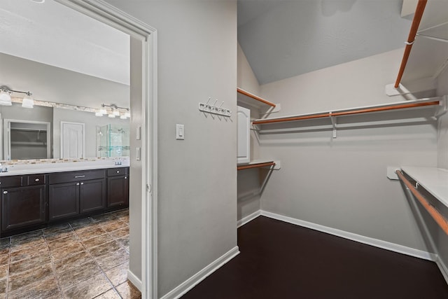 7931 Clarion Way, Houston, TX 77040 - walk in closet featuring vaulted ceiling