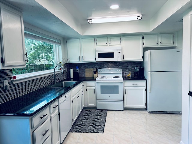 1902 Kings Arms Way, Katy, TX 77493 - kitchen with white appliances, dark countertops, tasteful backsplash, and light tile patterned floors