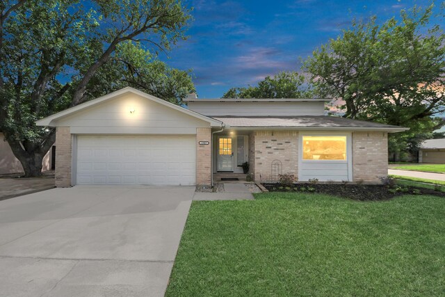 1902 Kings Arms Way, Katy, TX 77493 - ranch-style house with an attached garage, a yard, brick siding, and driveway