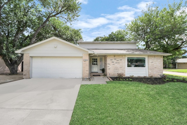 1902 Kings Arms Way, Katy, TX 77493 - ranch-style house featuring an attached garage, brick siding, driveway, and a front yard