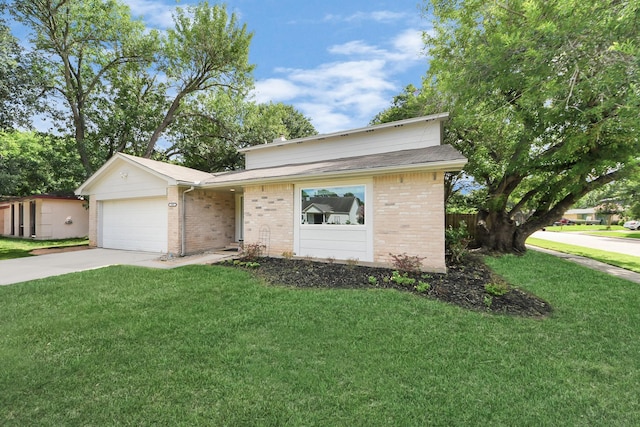 1902 Kings Arms Way, Katy, TX 77493 - view of front of home with driveway, brick siding, a front yard, and a garage