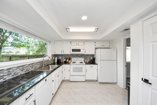 1902 Kings Arms Way, Katy, TX 77493 - kitchen with white appliances, dark countertops, tasteful backsplash, white cabinets, and recessed lighting