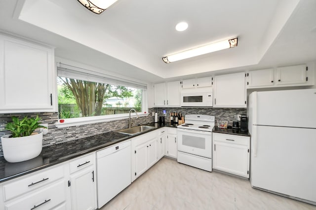 1902 Kings Arms Way, Katy, TX 77493 - kitchen featuring white appliances, dark countertops, white cabinets, tasteful backsplash, and recessed lighting