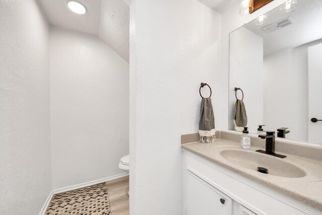 1902 Kings Arms Way, Katy, TX 77493 - bathroom with vanity and wood finished floors