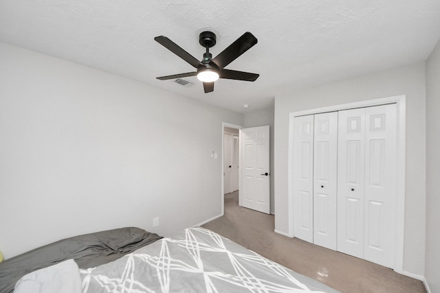 1902 Kings Arms Way, Katy, TX 77493 - unfurnished bedroom with carpet flooring, a closet, and ceiling fan