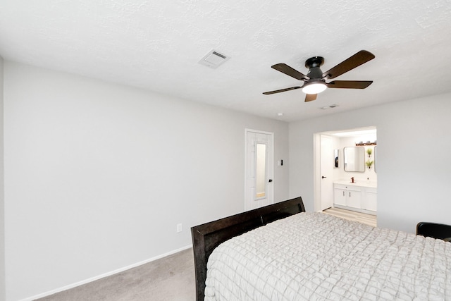 1902 Kings Arms Way, Katy, TX 77493 - bedroom featuring light colored carpet, ceiling fan, and ensuite bath