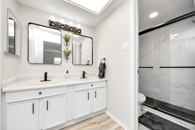 1902 Kings Arms Way, Katy, TX 77493 - full bathroom featuring double vanity, a marble finish shower, wood finished floors, and recessed lighting