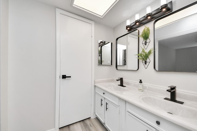 1902 Kings Arms Way, Katy, TX 77493 - full bathroom featuring double vanity and wood finished floors