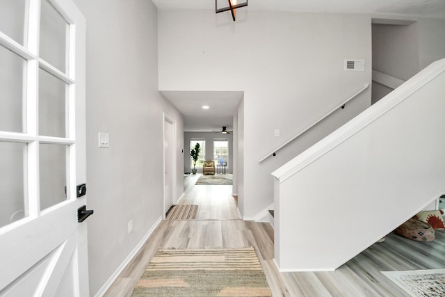 1902 Kings Arms Way, Katy, TX 77493 - entrance foyer with light wood finished floors, stairway, ceiling fan, and a towering ceiling