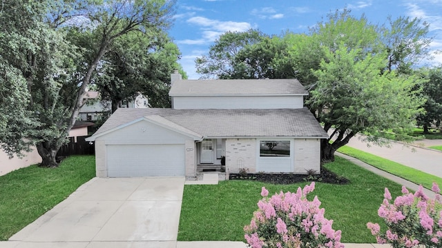 1902 Kings Arms Way, Katy, TX 77493 - view of front of property featuring a front lawn, brick siding, an attached garage, concrete driveway, and a chimney