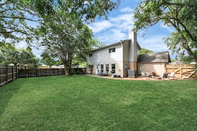 1902 Kings Arms Way, Katy, TX 77493 - back of house featuring brick siding, a chimney, a patio, and a fenced backyard