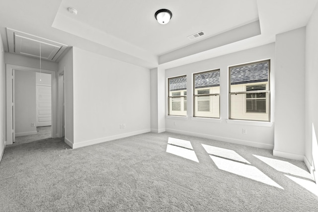 5049 Steady Breeze Dr, Katy, TX 77493 - carpeted spare room featuring attic access, baseboards, and a tray ceiling
