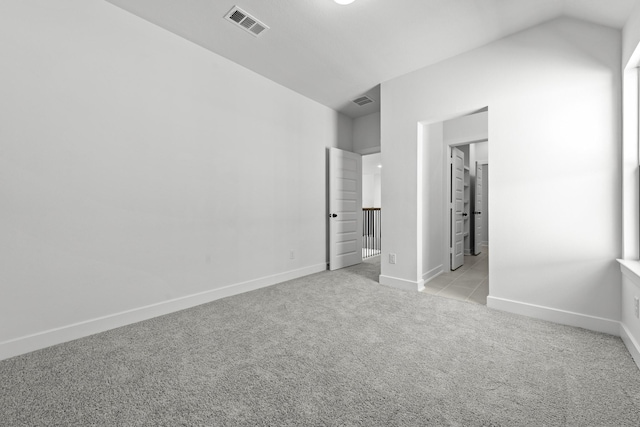 5049 Steady Breeze Dr, Katy, TX 77493 - unfurnished bedroom with light colored carpet, baseboards, and vaulted ceiling