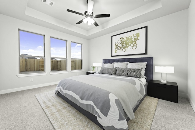 5049 Steady Breeze Dr, Katy, TX 77493 - bedroom featuring a tray ceiling, baseboards, carpet, and ceiling fan