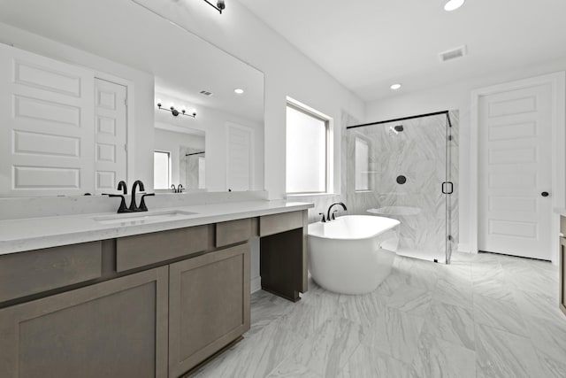 5049 Steady Breeze Dr, Katy, TX 77493 - bathroom with a marble finish shower, vanity, a freestanding tub, recessed lighting, and marble finish flooring