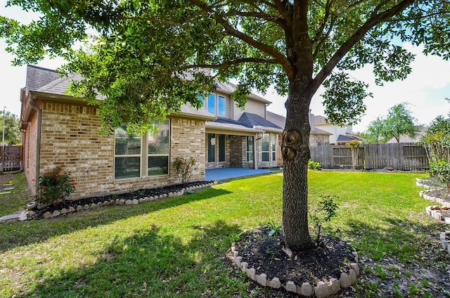 9819 St Romain Dr, Katy, TX 77494 - back of house with a patio and brick siding