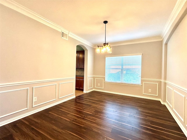 2528 Attwater Way, League City, TX 77573 - spare room with arched walkways, ornamental molding, dark wood-style flooring, a decorative wall, and wainscoting