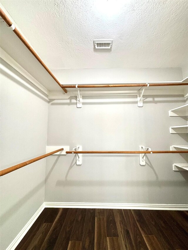 2528 Attwater Way, League City, TX 77573 - walk in closet featuring dark wood-type flooring
