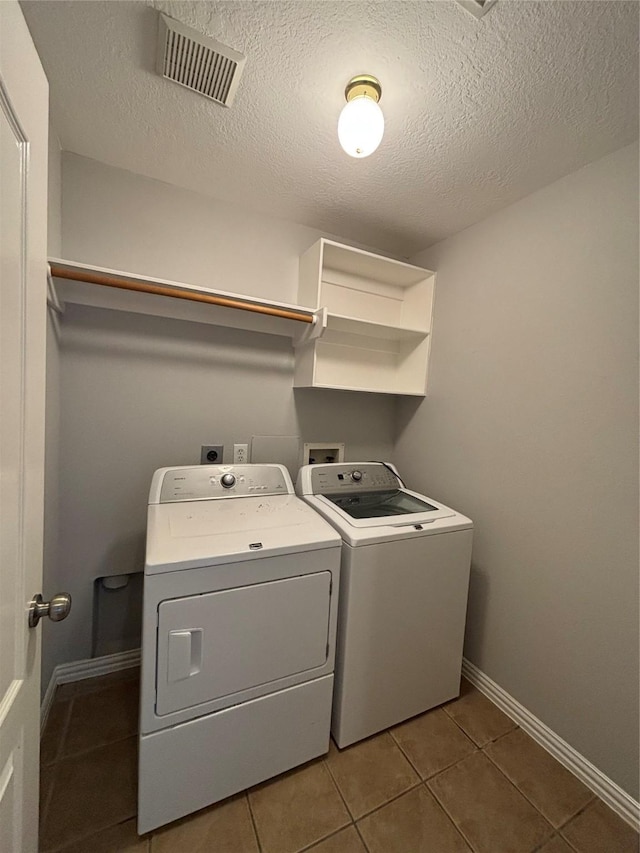 2528 Attwater Way, League City, TX 77573 - washroom featuring washer and dryer, tile patterned flooring, and baseboards