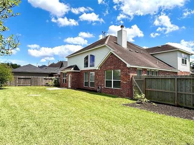 2528 Attwater Way, League City, TX 77573 - back of house featuring brick siding, a chimney, a shingled roof, and a patio