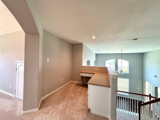 2528 Attwater Way, League City, TX 77573 - hall featuring light carpet, baseboards, a chandelier, an upstairs landing, and recessed lighting