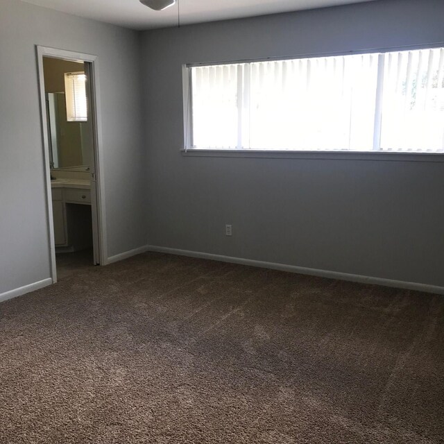 5471 Kuldell Dr, Houston, TX 77096 - carpeted spare room with a ceiling fan and baseboards