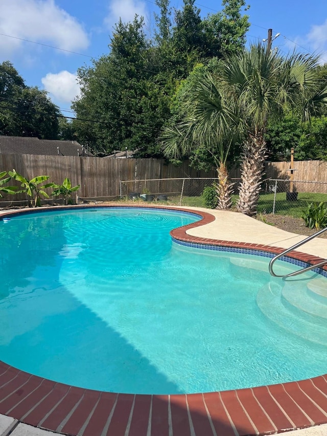 5471 Kuldell Dr, Houston, TX 77096 - view of swimming pool with a fenced backyard