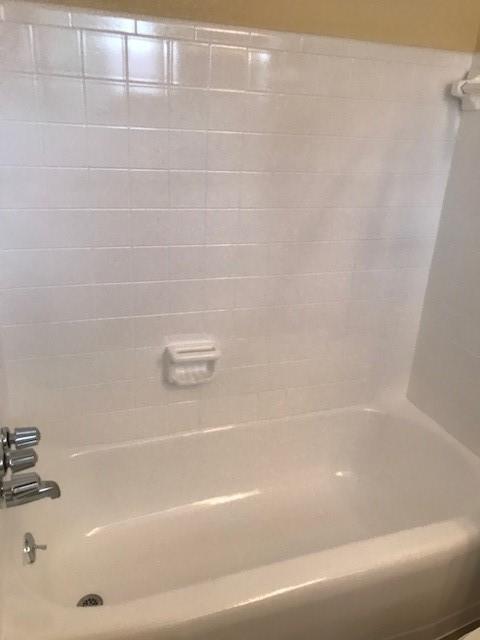 5471 Kuldell Dr, Houston, TX 77096 - bathroom featuring washtub / shower combination