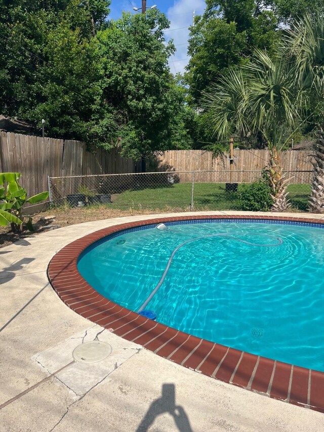 5471 Kuldell Dr, Houston, TX 77096 - view of swimming pool with a fenced backyard