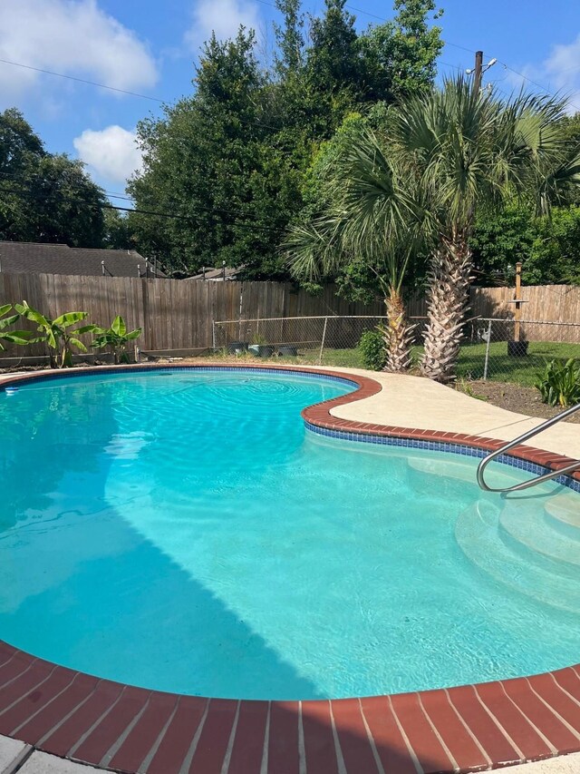 5471 Kuldell Dr, Houston, TX 77096 - view of swimming pool with a fenced backyard