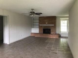 5471 Kuldell Dr, Houston, TX 77096 - unfurnished living room with a ceiling fan, a fireplace, and baseboards