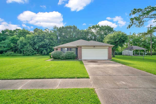 12821 Donegal Way, Houston, TX 77047 - view of front facade with an attached garage, brick siding, driveway, and roof with shingles