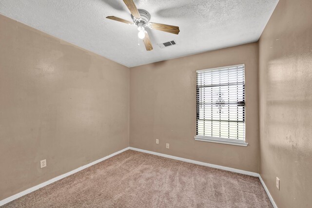 12821 Donegal Way, Houston, TX 77047 - carpeted empty room with a ceiling fan and a textured ceiling