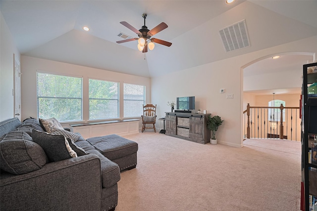 17207 Red Oak Bend Dr, Cypress, TX 77433 - carpeted living room with lofted ceiling, ceiling fan, arched walkways, and recessed lighting