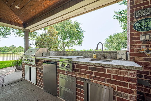 17207 Red Oak Bend Dr, Cypress, TX 77433 - view of patio / terrace featuring a sink, a water view, and beverage cooler