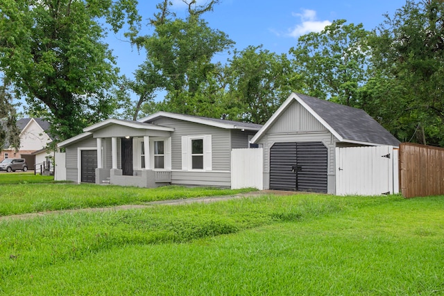 54 Lantana Ct, Lake Jackson, TX 77566 - view of front of property with a storage shed and a detached garage