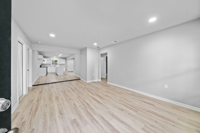 54 Lantana Ct, Lake Jackson, TX 77566 - unfurnished living room with light wood-type flooring and recessed lighting