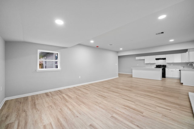 54 Lantana Ct, Lake Jackson, TX 77566 - unfurnished living room with recessed lighting and light wood-type flooring