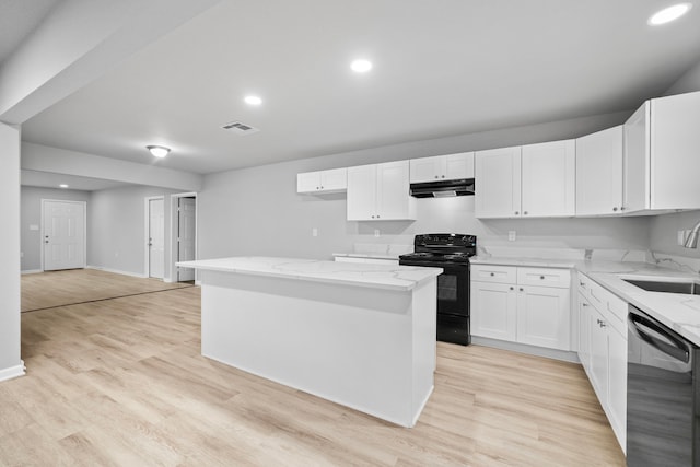 54 Lantana Ct, Lake Jackson, TX 77566 - kitchen with stainless steel dishwasher, black electric range oven, under cabinet range hood, light stone counters, and recessed lighting