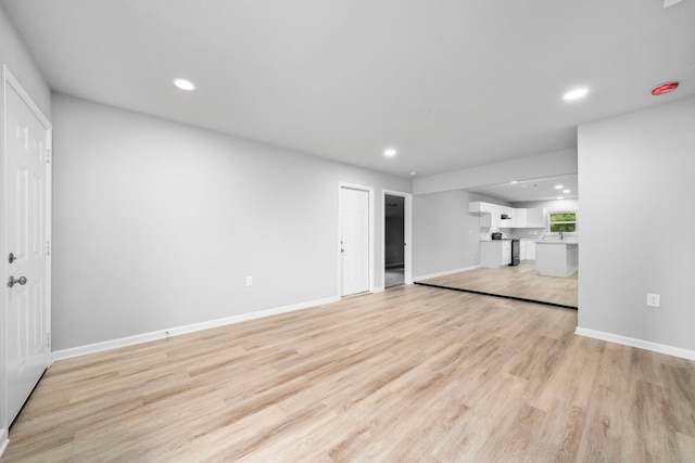 54 Lantana Ct, Lake Jackson, TX 77566 - unfurnished living room featuring recessed lighting and light wood-type flooring
